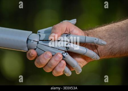 Robot hands with human intelligence. Human hands in robotic ai. Robot hands on digital innovation. Human hands with robot future. Stock Photo