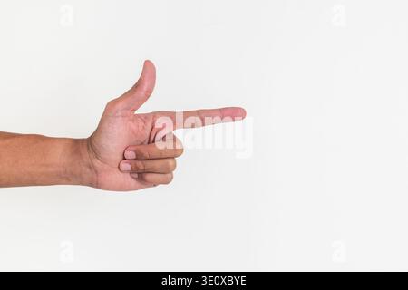 Man's hand with a gesture making a gun symbol or pointing at something Stock Photo