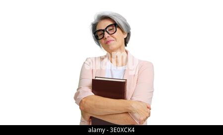 Confident mature woman holding book smiling Stock Photo