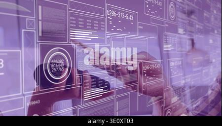 Touching two professionals in casual shirts manipulating glass wall display at office with charts Stock Photo