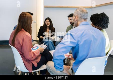 Diverse business team collaborating during meeting in office Stock Photo