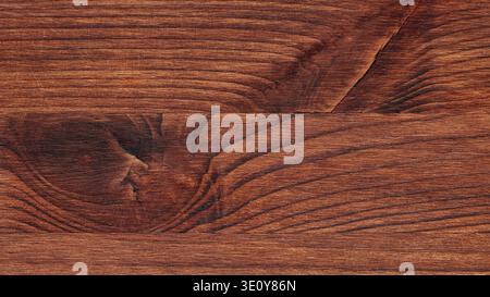Natural dark wood grain texture with knots showing rich brown tones and patterns Stock Photo