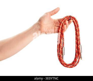 red instrumental audio cable in hand path isolated on white Stock Photo