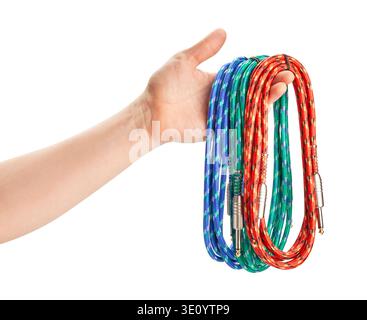 instrumental audio cables in hand path isolated on white Stock Photo