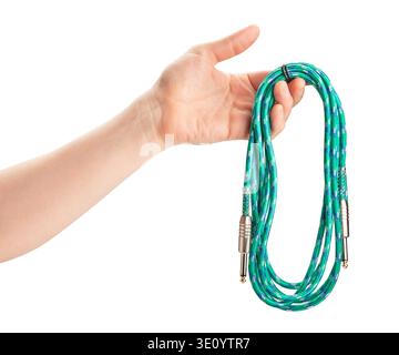 green instrumental audio cable in hand path isolated on white Stock Photo