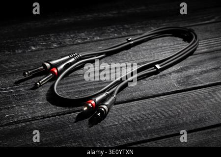 rca ts audio cable on black wood background Stock Photo
