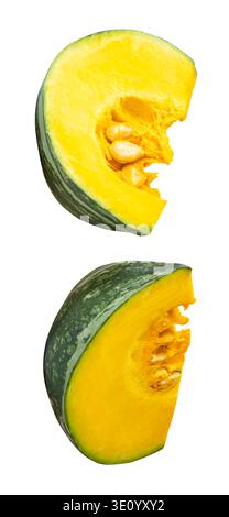 Green Japanese pumpkin fruit in two quarters or slices in set is isolated on white background with clipping path. Stock Photo