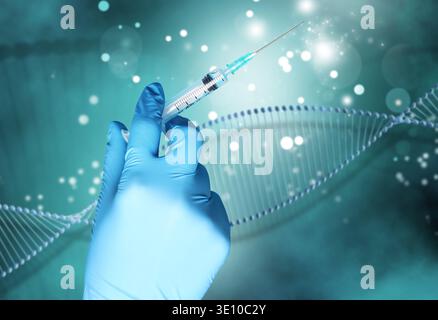 Scientist holding syringe against DNA spiral, closeup. Biochemistry and researches in genetics Stock Photo
