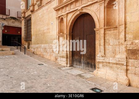 Facade of the Royal Hospital of Xativa with its Renaissance door and stone reliefs on March 14, 2026, Spain Stock Photo