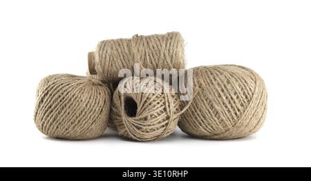 A group of rustic twine balls, perfect for crafting or adding a natural touch to various projects, isolated on a white backdrop Stock Photo