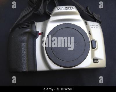 Minolta Dynax 500si camera with Sony lens cap resting on black background Stock Photo