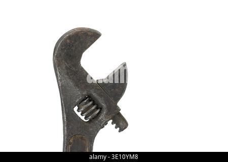 Close-up of an old, worn and rusty looking adjustable wrench isolated on a white background with free copy space for text Stock Photo