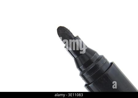 Detailed close-up of black permanent marker with white background. Ideal for office supplies, school projects, and art use Stock Photo