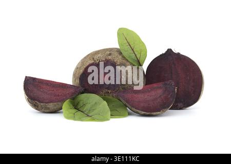 Collection of whole beetroots arranged alongside slices of beetroot, complete with their green leaves isolated on white background Stock Photo