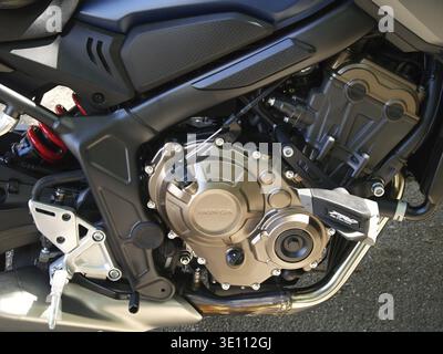 Close-up of a Honda motorcycle engine, highlighting intricate details, metallic components, and precision engineering Stock Photo