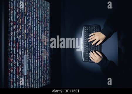 Cyber security threat. Young woman using computer and coding. Internet and network security. Stealing private information. Person using technology to Stock Photo