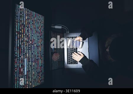 Cyber security threat. Young woman using computer and coding. Internet and network security. Stealing private information. Person using technology to Stock Photo