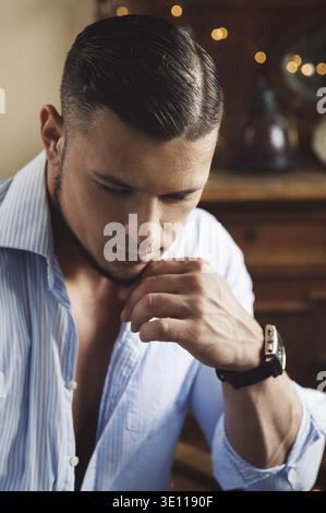 Portrait of handsome young man wearing blue shirt Stock Photo