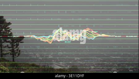 Displaying multi-colored waveform overlay moving across misty hillside overlook, with gridlines Stock Photo