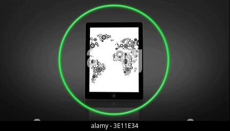 Displaying black tablet showing white-screen gear map in studio with green neon ring reflecting Stock Photo