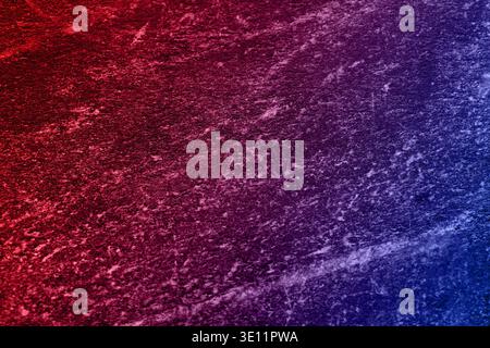Neon lights on textured surface. Color gradient from red to blue Stock Photo