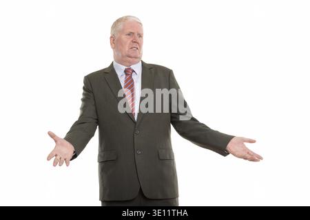 Studio shot of thoughtful mature businessman looking confused while looking at distance Stock Photo