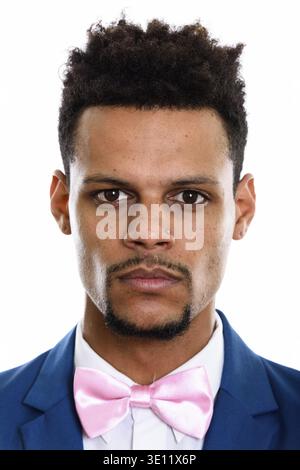 Face of young African businessman wearing tuxedo isolated against white background Stock Photo