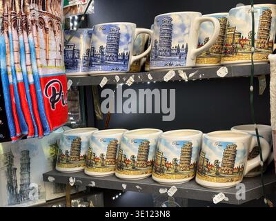 Leaning Tower souvenir mugs, Torre di Pisa. Pisa, Italy. Tourist giftware featuring the iconic Romanesque structure, displaying prices in Euros. Stock Photo
