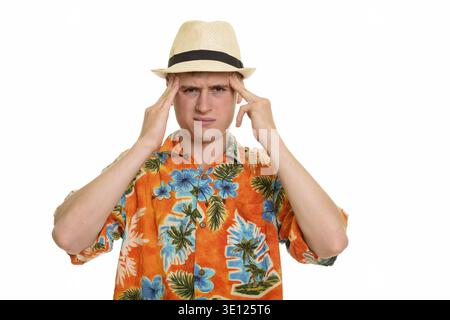 Young Caucasian man having headache isolated against white background Stock Photo
