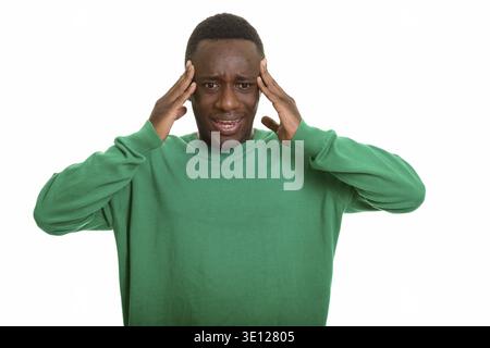 Young African man having headache isolated against white background Stock Photo