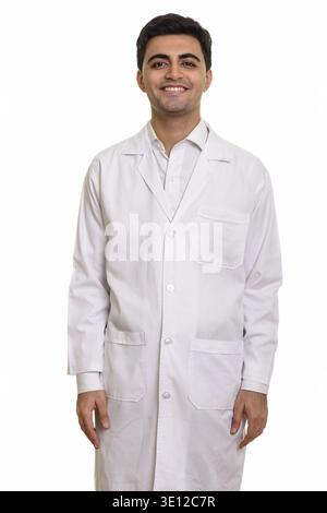 Young happy Persian man doctor isolated against white background Stock Photo