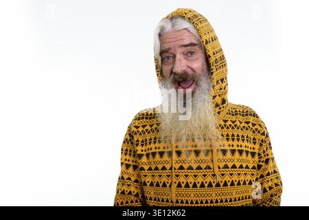 Studio shot of happy senior bearded man smiling while wearing hoodie Stock Photo