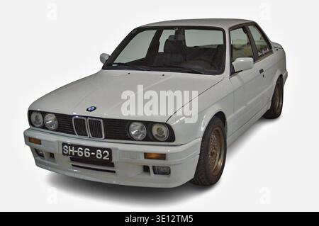 White BMW E30 3 Series two-door coupe against a clean white background Stock Photo