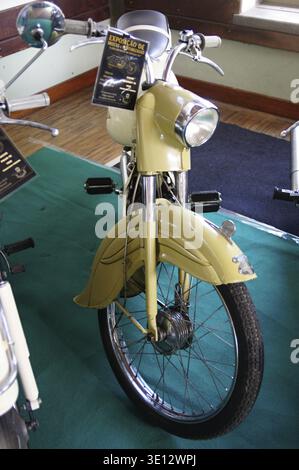 Vintage beige moped front view at a classic vehicle exhibition Stock Photo