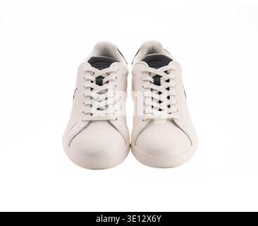 Modern off white mens sneakers by Polo Ralph Lauren featuring lace up design and dark heel accent against a clean white backdrop for fashion retail Stock Photo
