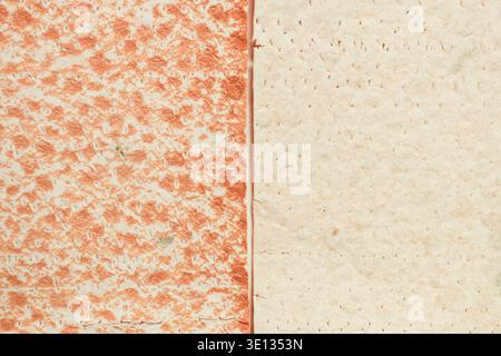 Left side features reddish-orange speckles against a creamy base. Right side is plain, soft-toned, and subtly mottled. Paper edges are clean Stock Photo