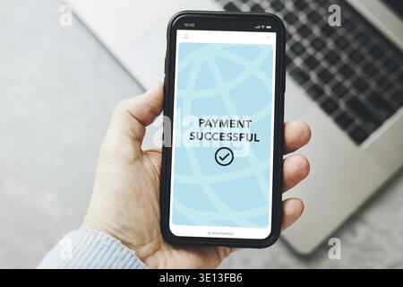 Man paying with smartphone for online shopping. Paying using fast secure payment system. Paying bills using express payment technology. Paying expense Stock Photo