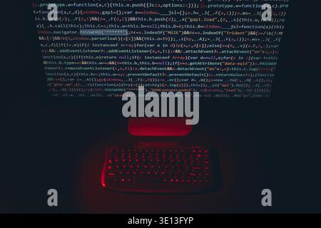 Cyber security. Program code on screen. Using computer and programming to break code. Cyber security threat. Internet and network security. Stealing p Stock Photo