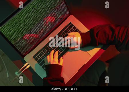 Anonymous people using computer and programming to break code. Cyber security threat. Internet and network security. Access to private information. An Stock Photo
