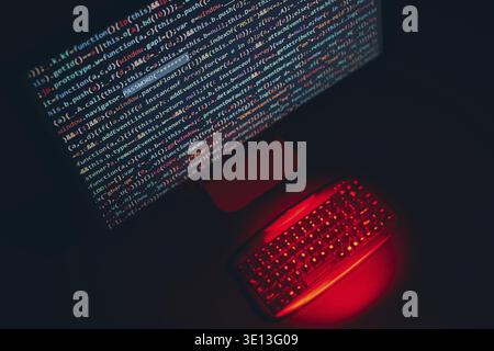 Cyber security. Program code on screen. Using computer and programming to break code. Cyber security threat. Internet and network security. Stealing p Stock Photo