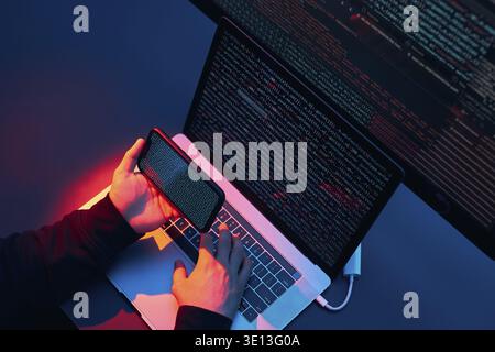 Man using computer and programming to break code. Cyber security threat. Internet and network security. Stealing private information. Person using tec Stock Photo