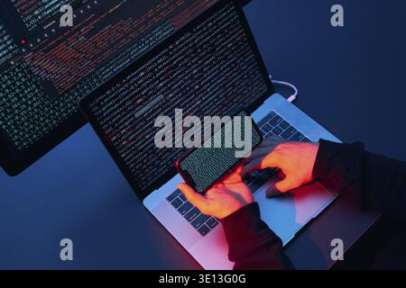 Man using computer and programming to break code. Cyber security threat. Internet and network security. Stealing private information. Person using tec Stock Photo