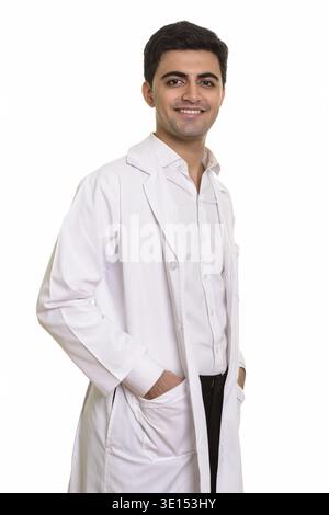 Young happy Persian man doctor isolated against white background Stock Photo