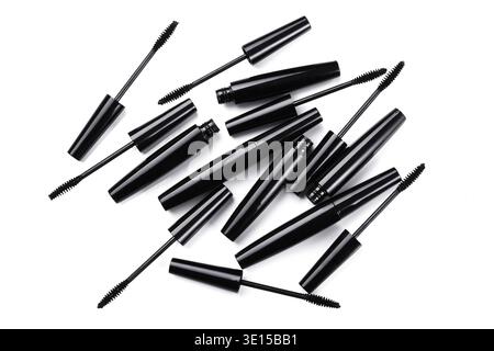 Mascara brushes and containers on white background Stock Photo