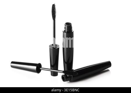 Mascara brushes and containers on white background Stock Photo