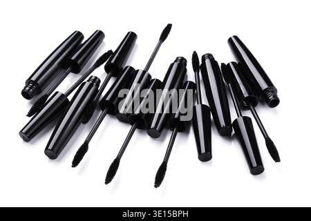 Mascara brushes and containers on white background Stock Photo