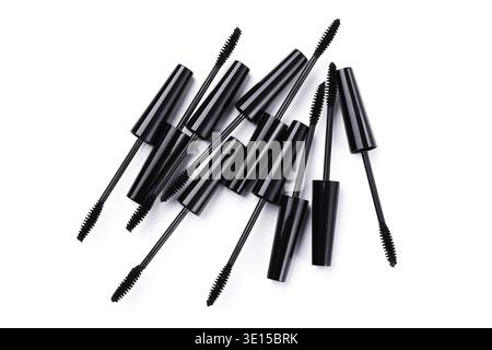 Mascara brushes and containers on white background Stock Photo