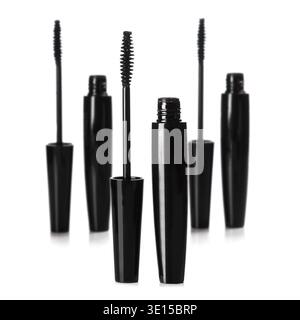 Mascara brushes and containers on white background Stock Photo