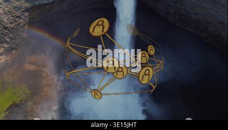 Floating golden network sphere hovering over plunging waterfall and mist in rocky gorge, rainbow Stock Photo