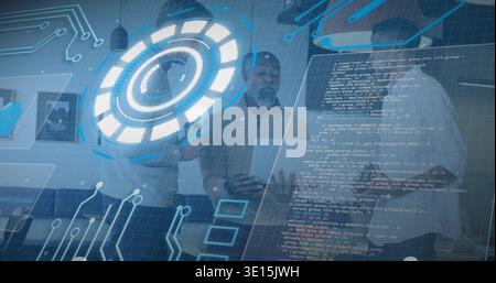 Standing tech team in business shirts studying hologram HUD in modern office, with code overlays Stock Photo
